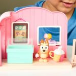 Kid-playing-with-a-Bluey-Ice-Cream-Shop-Playset.jpg